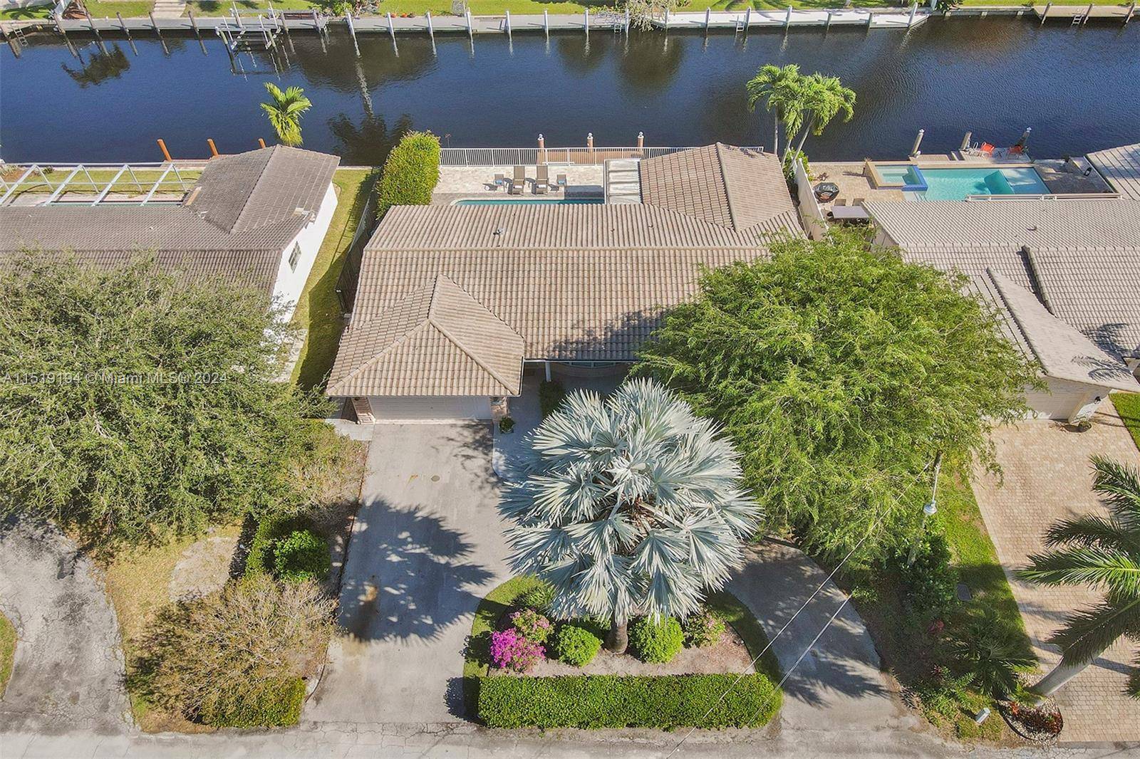 COME AND FALL IN LOVE ! WALK IN AND SEE THIS WELL APPOINTED FULLY FURNISHED 4 BEDROOMS 3 BATHROOMS WATERFRONT POOL HOME FEATURES PRIVATE DOCK WITH 75 FEET OF CANAL ...