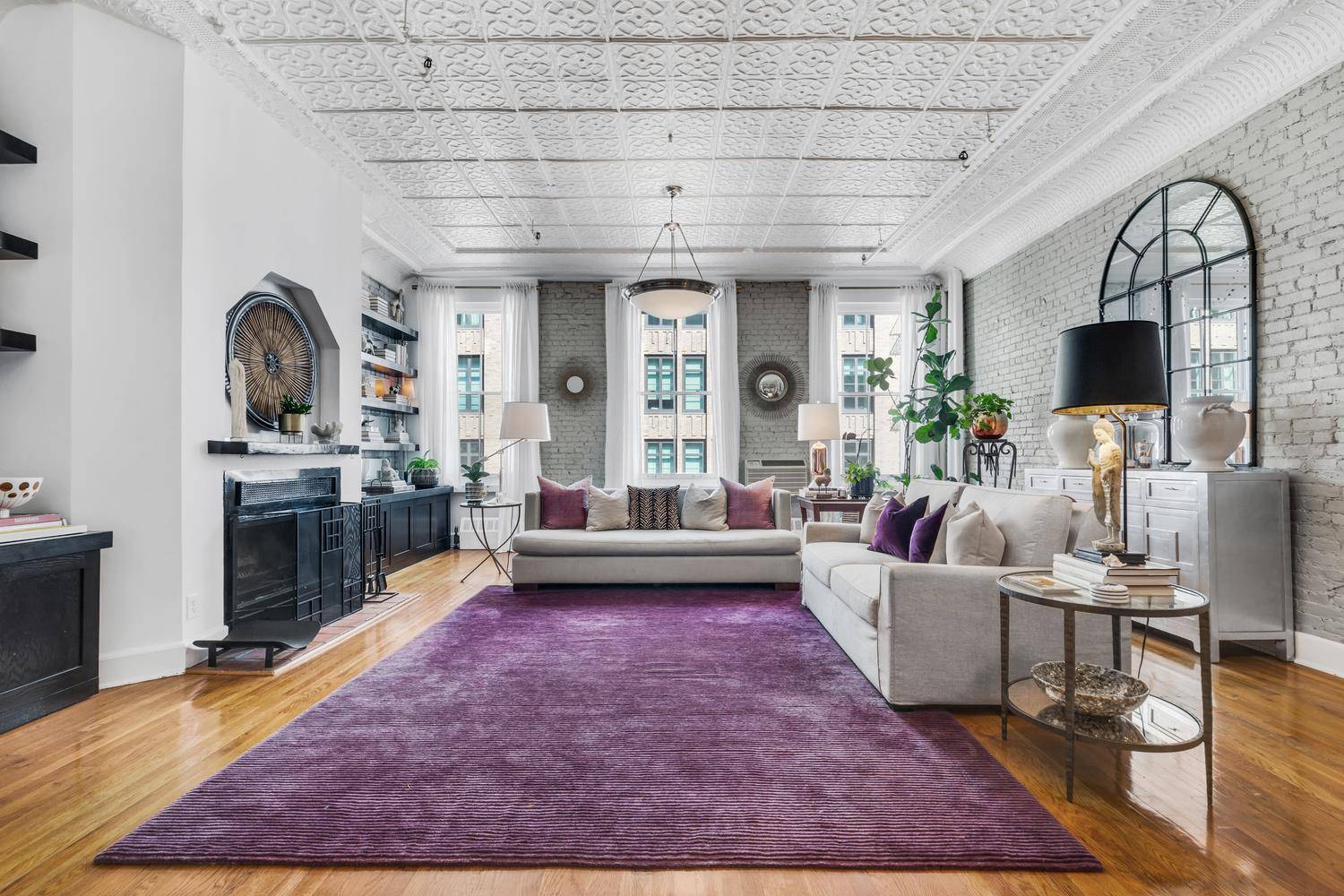 This beautifully designed, 1500 sf classic loft in the heart of TriBeCa will charm you with its almost 12 foot tin ceilings, exposed brick walls, hardwood floors and oversized windows.