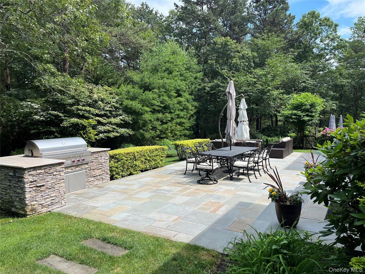 View of patio / terrace with an outdoor kitchen and outdoor dining area