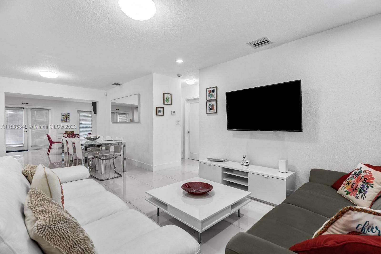 Completely furnished. Gorgeous contemporary home, exceptionally luminous, completely renovated, featuring a spacious backyard with a sizable heated pool.