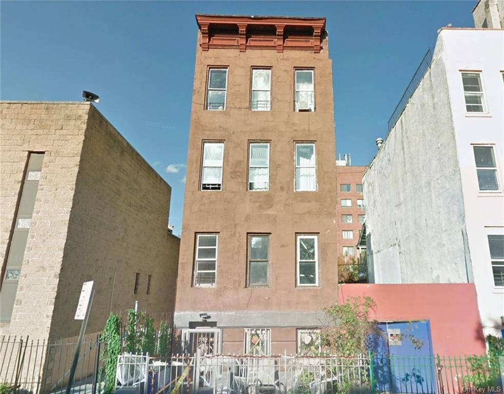 East Harlem Brownstone building for sale on East 118th between 1st and 2nd Avenue.