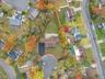 Aerial perspective of suburban area featuring property parcel outlined
