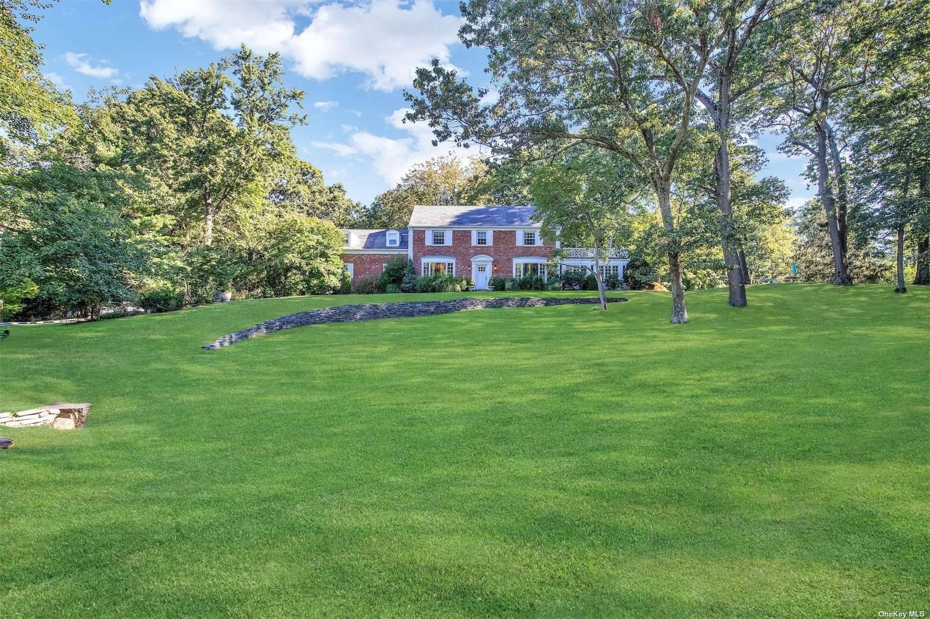 Majestic Brookville 3 acre estate like property, with sparkling inground pool, playground, slate patio, rolling emerald lawns, inground sprinklers, and 2 car garage.