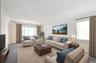 Living room featuring light carpet