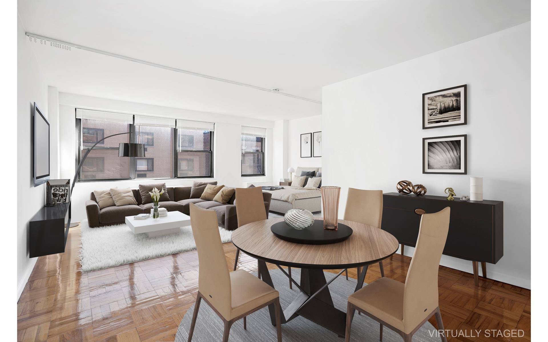 Spacious and Sunny East 20s Alcove Studio in a 24 Hour Doorman Building with 4 Front Facing Windows providing Natural Light and a View of the Empire State Building.