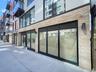 Doorway to property featuring brick siding