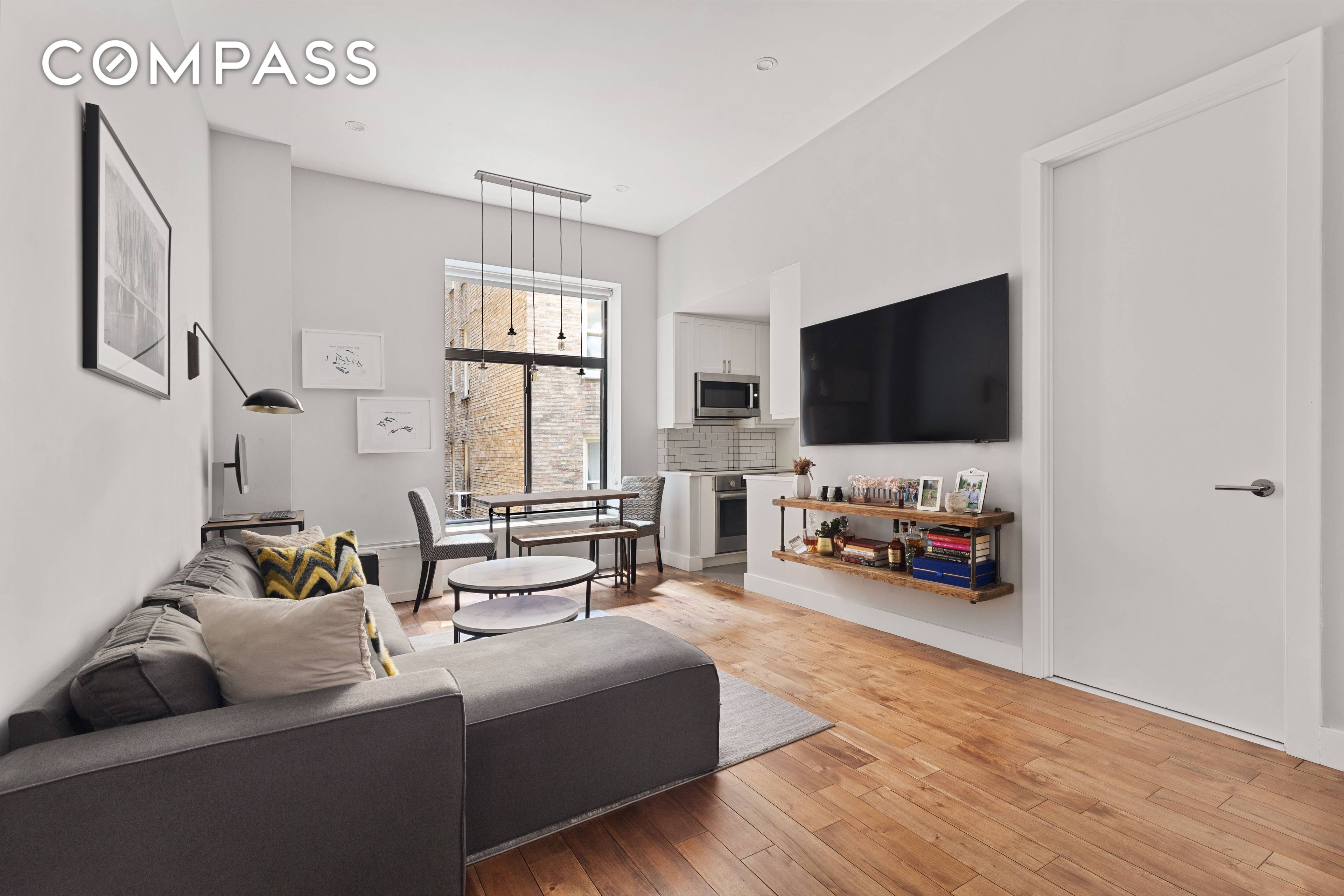 11 Foot ceilings, exposed brick walls, and over sized windows immediately command your attention as you enter this immaculate apartment.