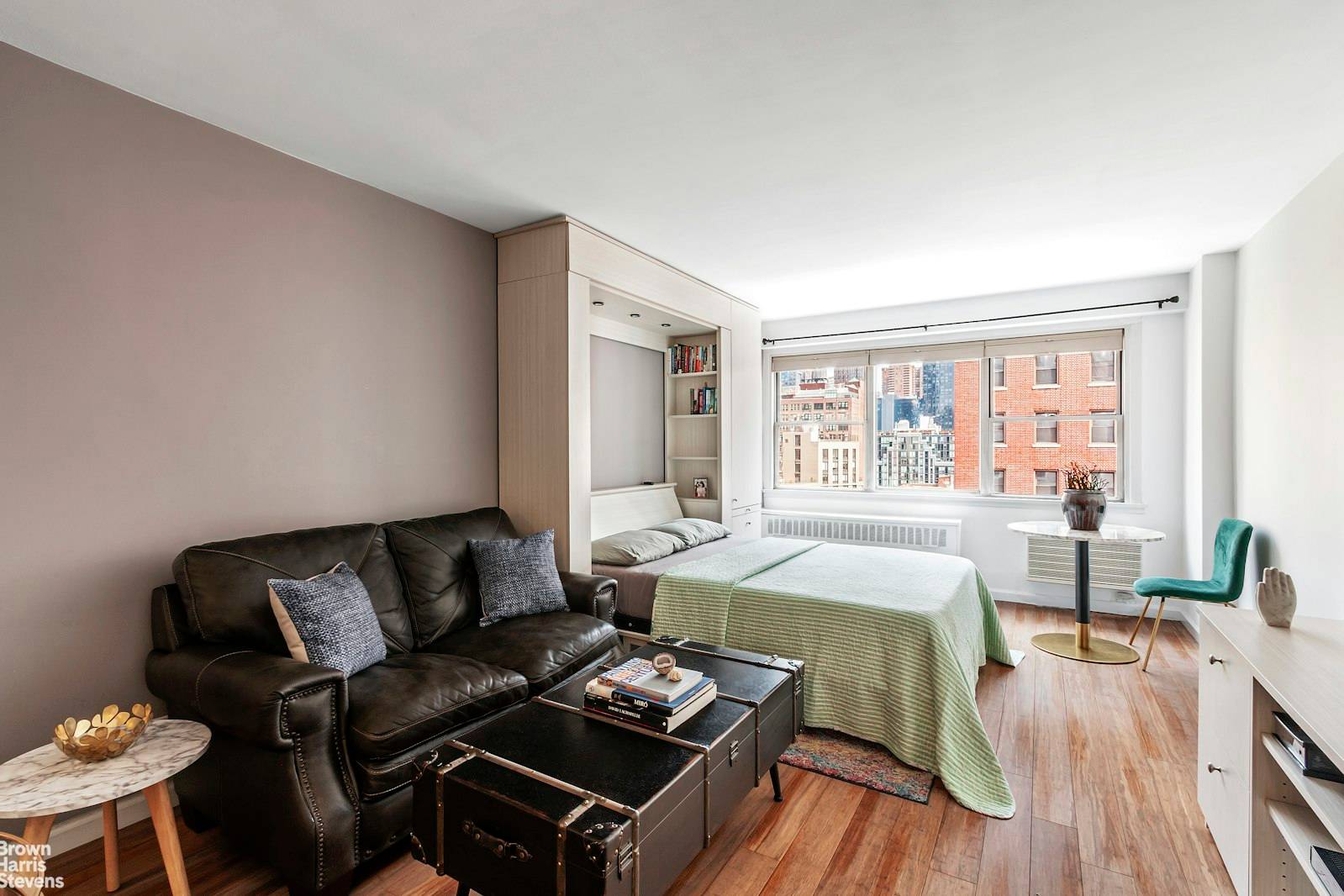 Perched high up on the 12th floor, this renovated studio features open views of Midtown.