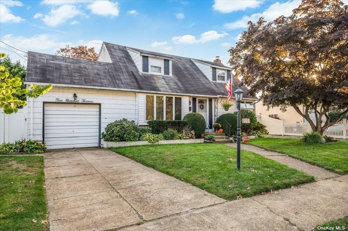 Located in Massapequa Park, this charming Westwood Cape boasts a full rear dormer, three bedrooms, one of which was converted into a laundry room, and two full bathrooms.