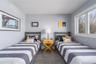 Carpeted bedroom featuring visible vents