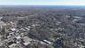 Aerial view of property's location with a forest