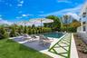 View of swimming pool featuring a fenced backyard and a patio area