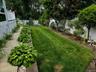 Backyard with retaining wall, igs, and specimen plantings