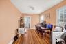 Dining area featuring light wood-style flooring and baseboards