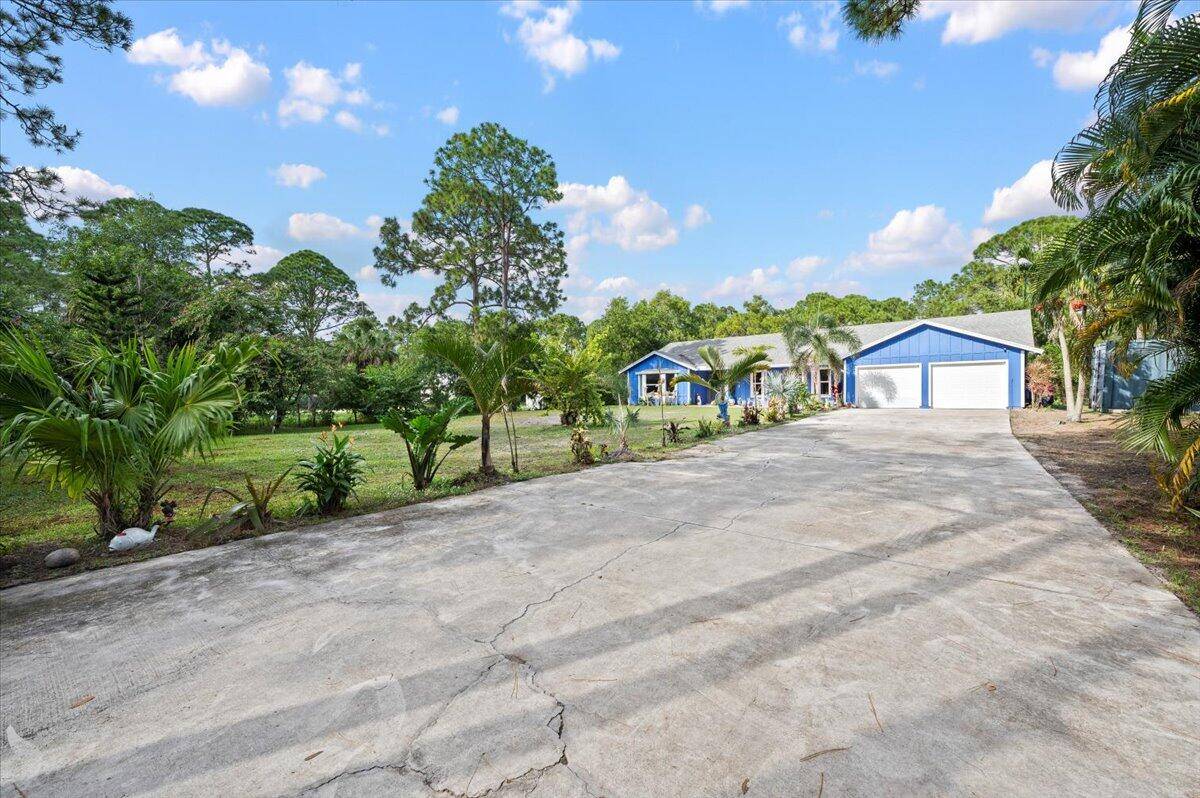 Welcome to your new homestead located in the highly sought after Jupiter Farms Equestrian community.