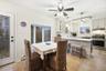 Dining space with light wood-style flooring, healthy amount of natural light, a ceiling fan, and a baseboard radiator
