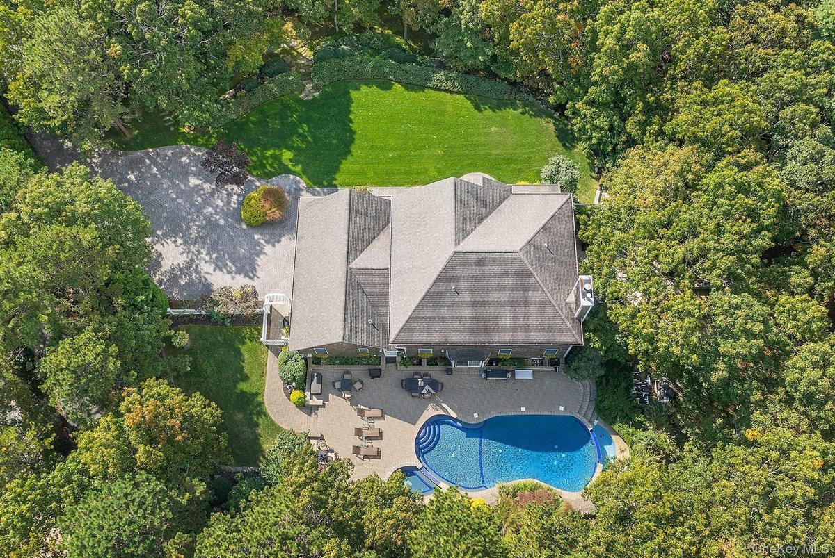 View of subject property with a pool area