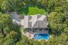 View of subject property with a pool area
