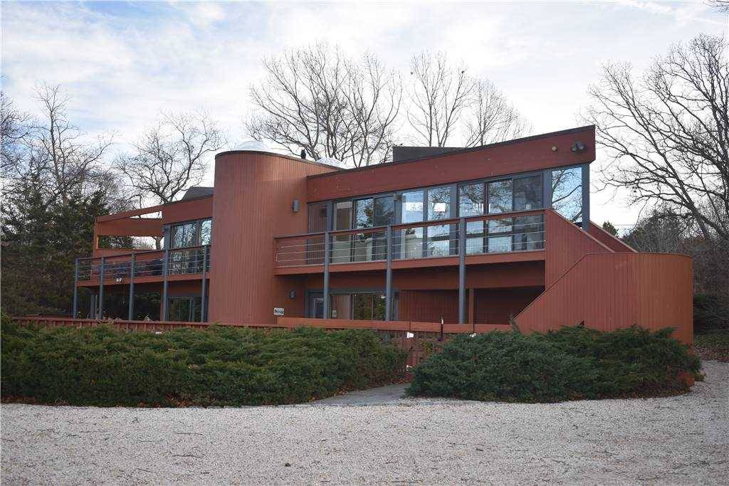 Enjoy breathtaking views over Cold Spring Pond and Peconic Bay from this contemporary home.