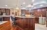 Custom Kitchen: Prep Sink, Snackbar, Custom Cabinets with under and over lighting, Hybrid Induction Cooktop, Hidden walk-in pantry