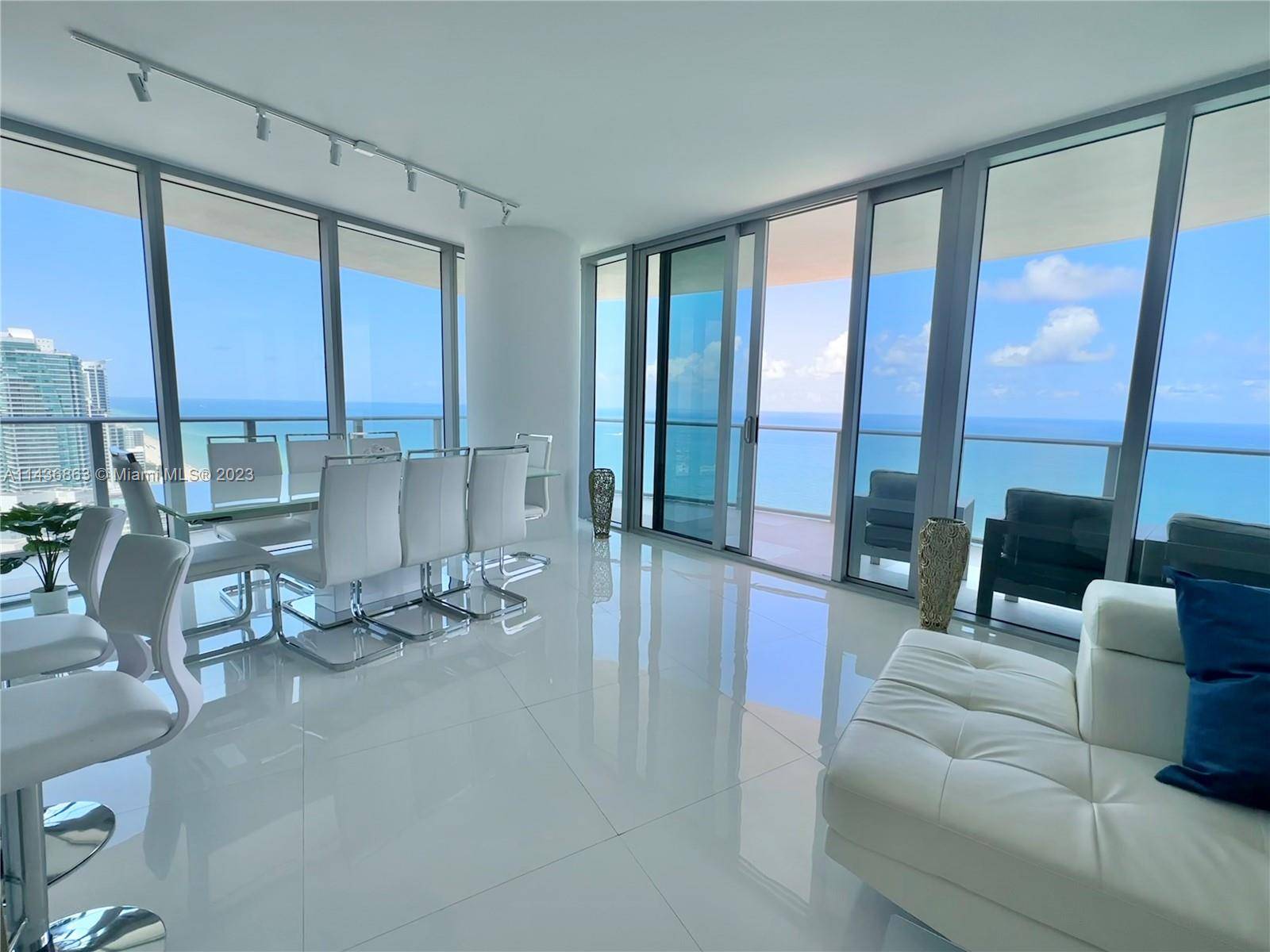 This luxurious Florida condo has unbeatable 180 degree direct ocean views with a great size rounded terrace to match.