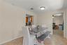 Bright Florida room offering flexible living space and convenient access to the fourth bedroom, making it ideal for use as a home office, guest suite,