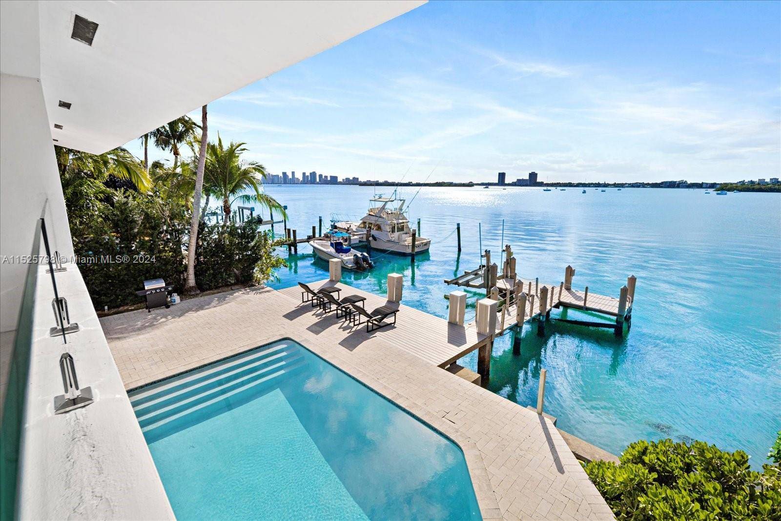 This stunning waterfront estate offers sweeping open bay views, located in the gated community of North Bay Island.