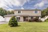 5 Bedroom 2.5 Bath Colonial with wide apron and driveway for extra parking.