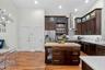 Kitchen island offers prep space, storage, and casual functionality.