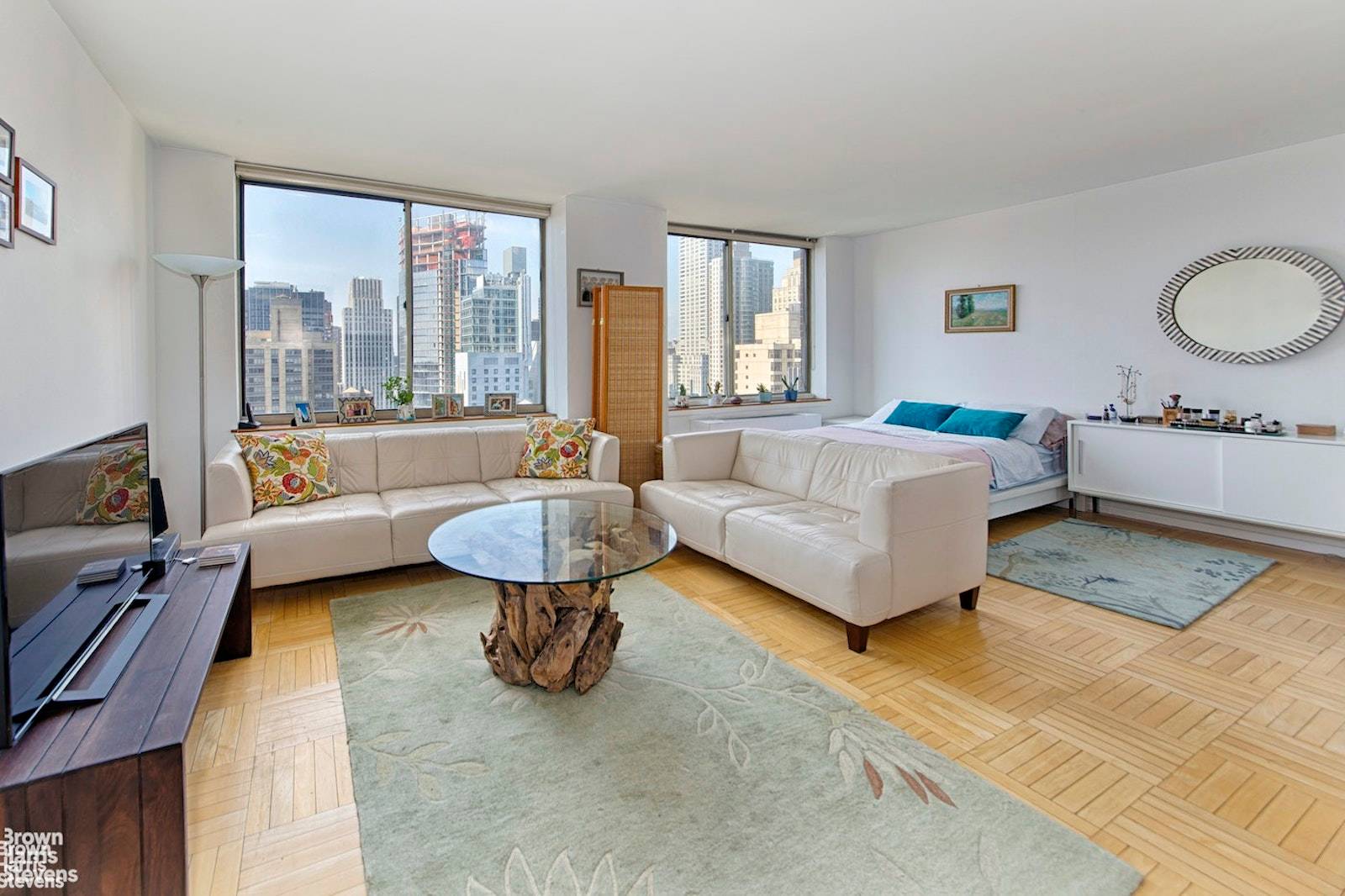 Enjoy open southern river and skyline views from this spacious alcove studio.