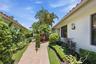 Private entrance and landscaped front yard in Wellington FL pool home for rent