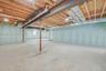 Full basement with high ceilings and outside entrance, offering excellent potential for future finished space or storage.
