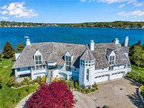 SELECTED AS MANSION GLOBAL LISTING DRAMATIC DIRECT WATERFRONT WITH 285 OF PRIVATE BEACHFRONT, POOL AND FLOATING DOCK.