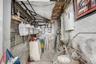 Utility room featuring gas meter and tankless water heater