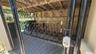 The free, secure bike storage is immediately in front of this condo's covered parking space