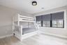 Bedroom featuring wood finished floors and baseboards