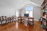 Office area featuring wood finished floors and vaulted ceiling