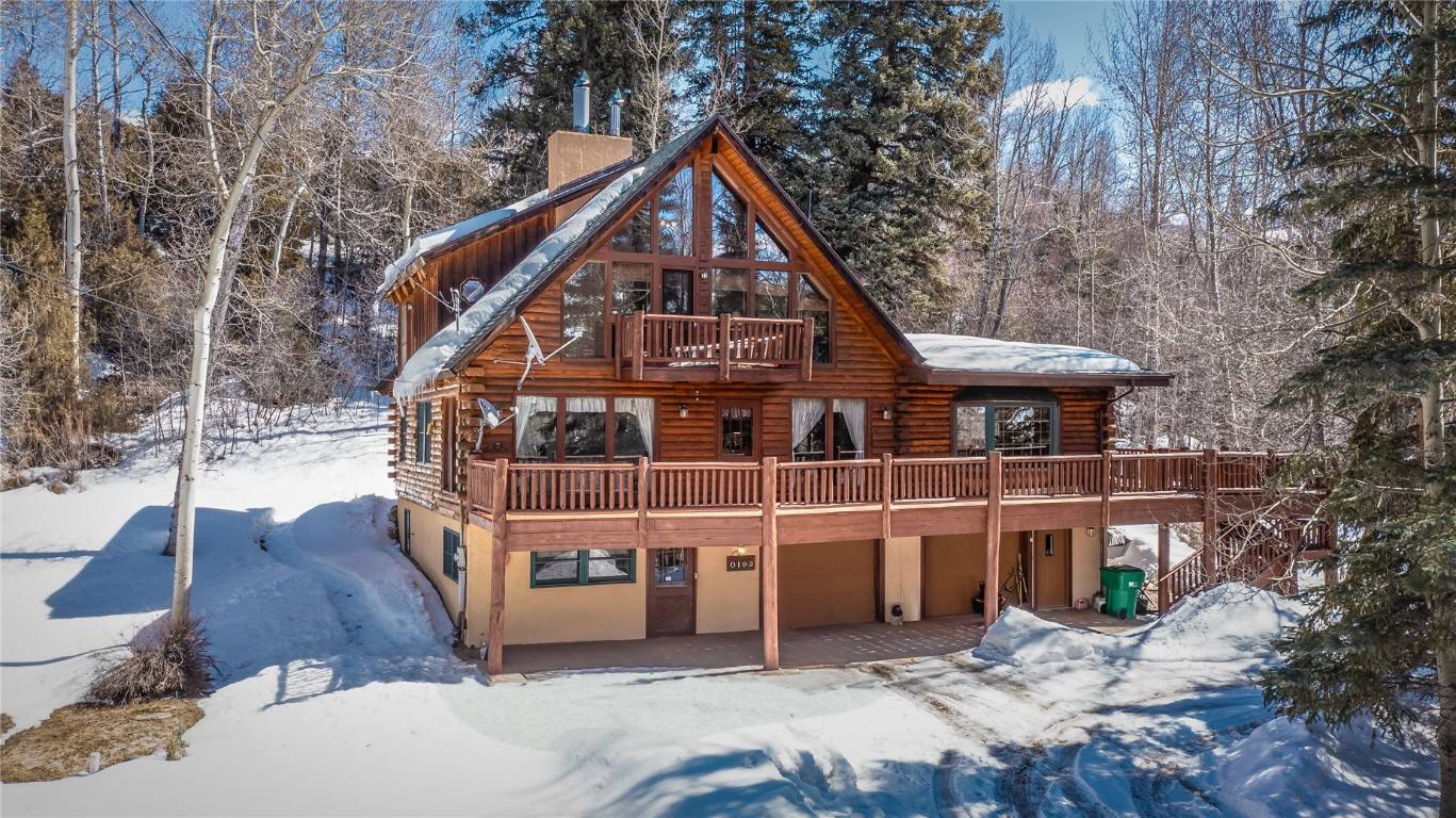 Nestled on 2. 48 acres, this riverfront log home is a true mountain retreat.