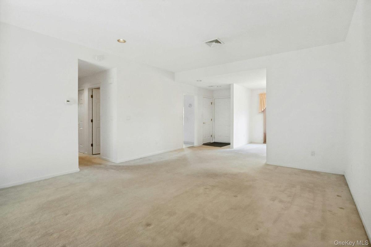 Showing lots of wall space, entry to hall & Hall/guest bathroom with shower.
