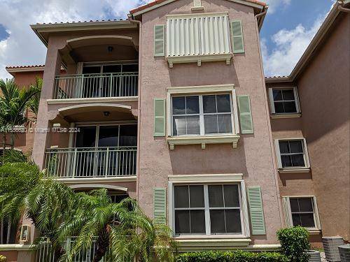 Spacious second floor 2 bed 2 bath condo with walk in closets and wood flooring throughout !