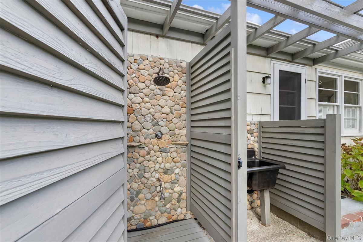 View of exterior entry with stone siding