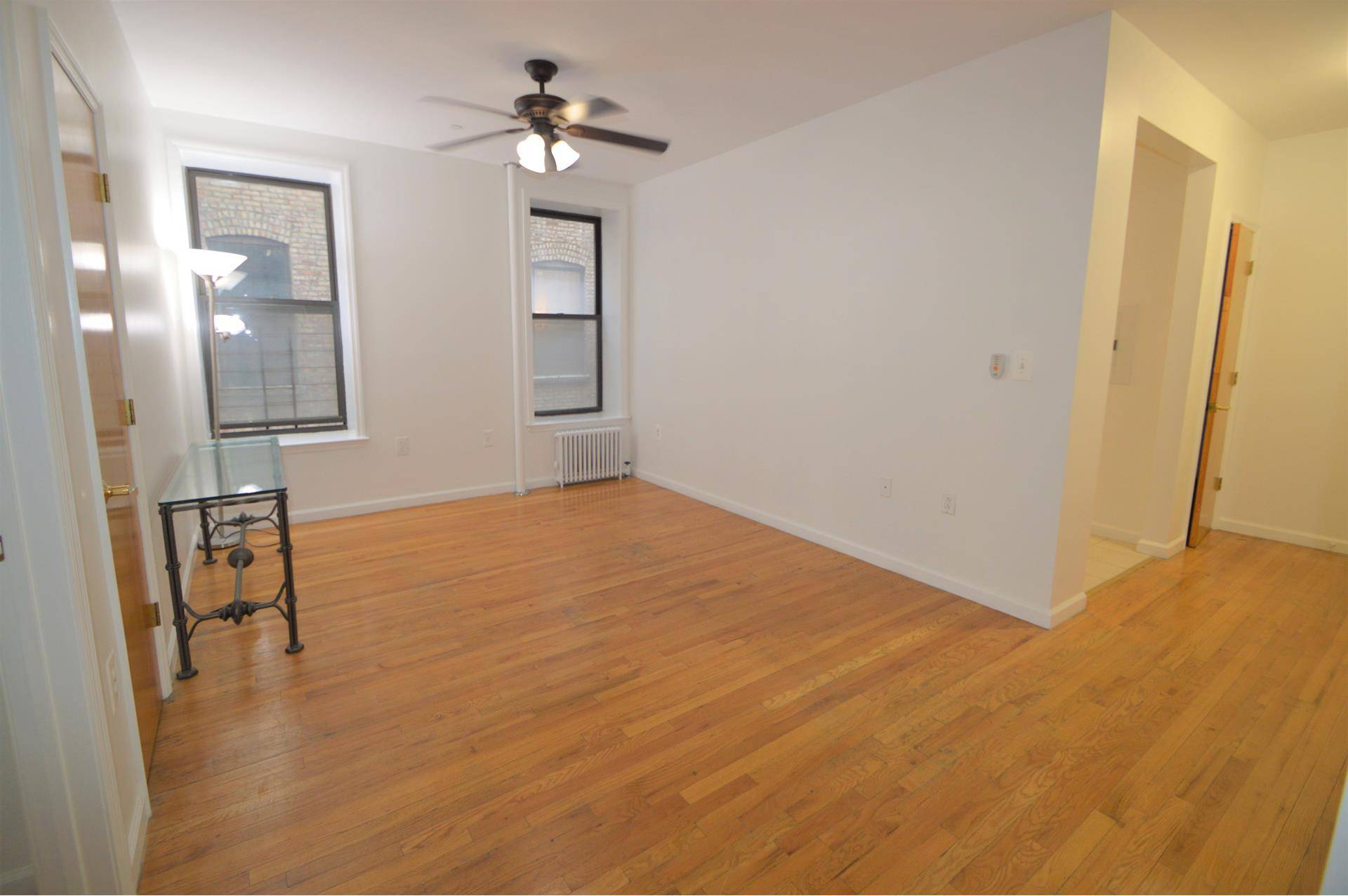This spacious two bedroom one bathroom apartment is located in the residential Washington Heights neighborhood.