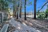 Follow the Brick path to the Tennis Court from the Pool to Courtyard and Front Yard