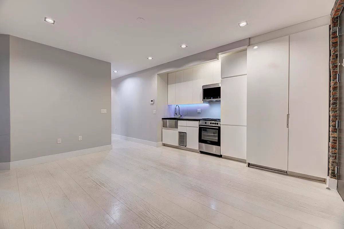 Renovated 4 bedroom apartment with 2 marble bathrooms, and granite kitchen with a dishwasher and wine cooler.