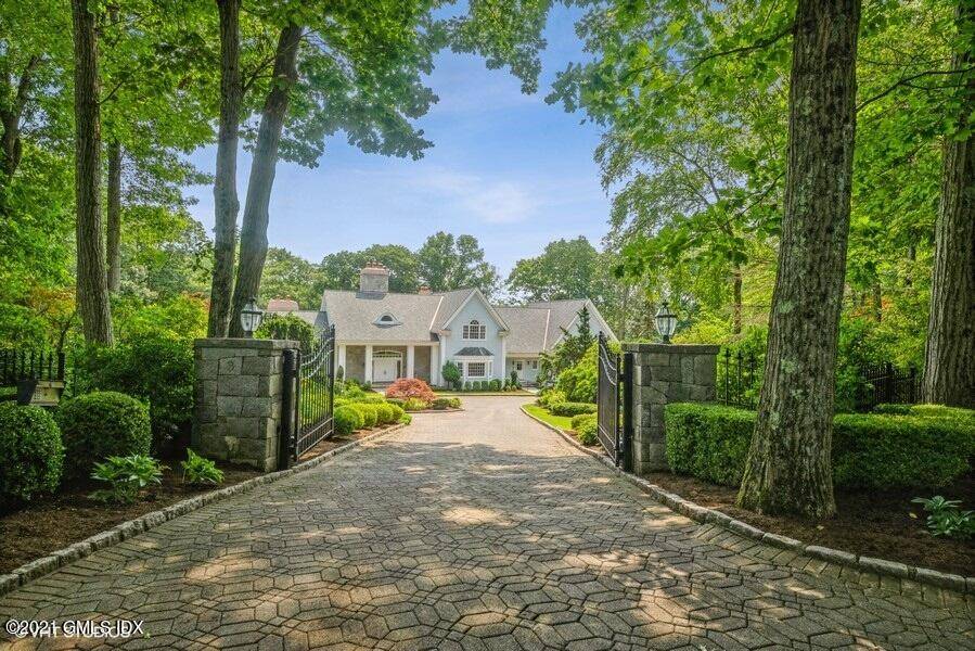 Stunning back country estate with gated entrance offers a paradise of privacy and serenity.