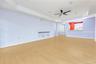 Living Room with a tray ceiling, ornamental molding, wood finished floors, a ceiling fan, and recessed lighting