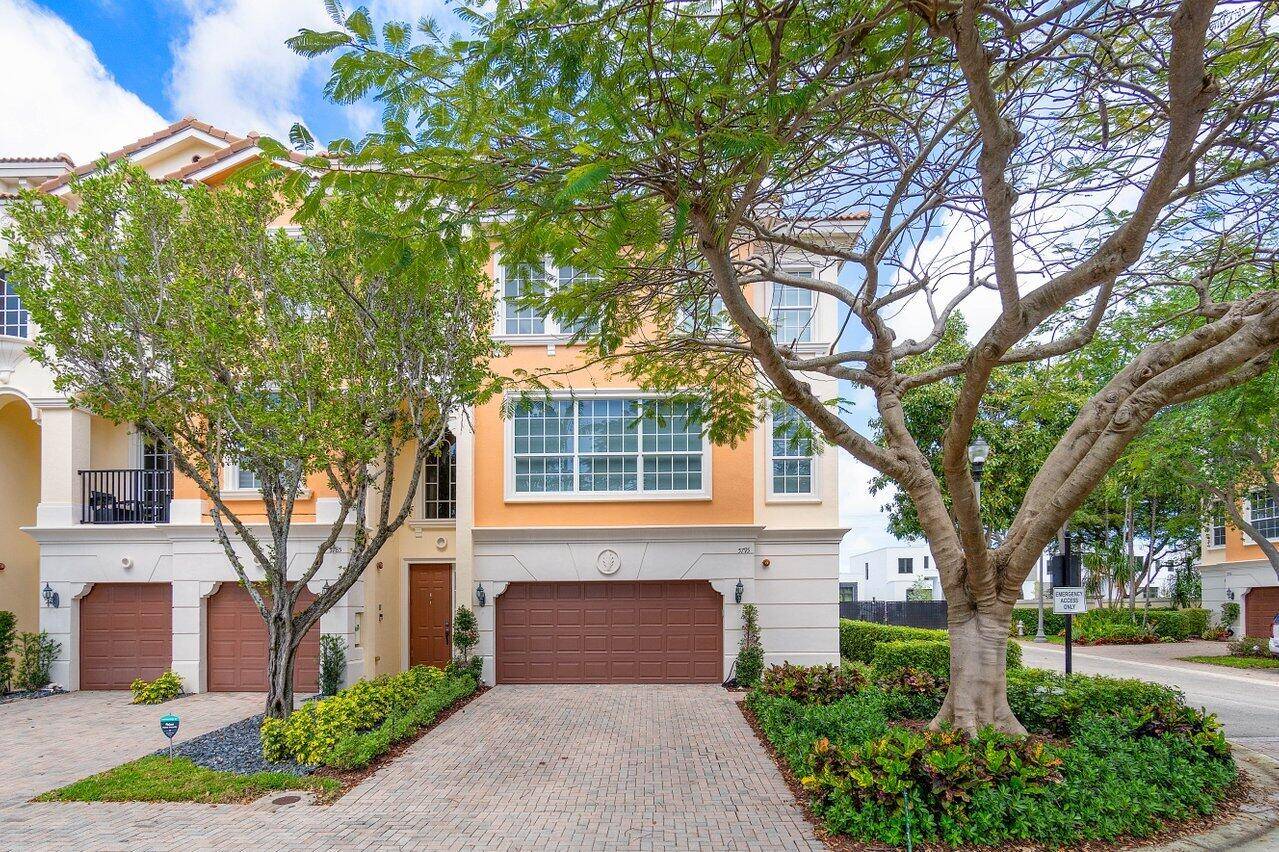 Absolutely stunning luxurious fully renovated and meticulously customized tri level corner townhouse in highly sought after East Boca Raton gated community Trieste at Boca Raton.