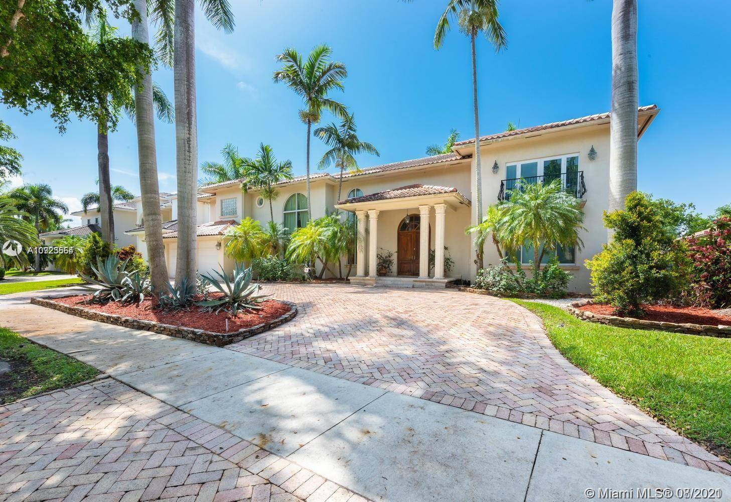 Custom palatial home located inside the Mansions section of the private guard gated community of Royal Palm Estates.
