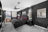 Expansive primary suite with a dramatic, comfortable feel.