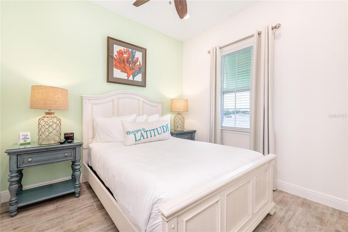Bright guest bedroom with natural light located in Margaritaville Resort Orlando vacation home community